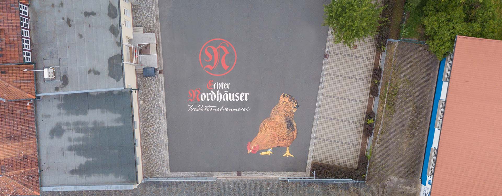 Bodenmalerei: Firmen Logo für die Traditionsfirma Nordhäuser.